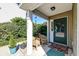 Inviting front porch with cozy seating and charming details at 1929 Treebark Dr, Charleston, SC 29414