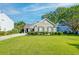 Charming single-story home with a well-manicured lawn and neatly trimmed hedges, enhancing its curb appeal at 1929 Treebark Dr, Charleston, SC 29414