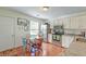 Eat-in kitchen area with modern stainless-steel appliances and wood-look flooring at 1929 Treebark Dr, Charleston, SC 29414