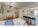 Bright living room featuring a cozy breakfast bar, hardwood floors, and recessed lighting at 1929 Treebark Dr, Charleston, SC 29414