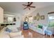 Spacious living room with hardwood floors, comfortable seating, and a ceiling fan at 1929 Treebark Dr, Charleston, SC 29414