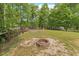 Expansive backyard featuring a fire pit, raised garden beds, and a privacy fence, perfect for outdoor entertaining at 1953 Suzanne St, Johns Island, SC 29455