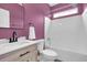 This bathroom features striking pink walls, a tub with shower, and a modern vanity at 1953 Suzanne St, Johns Island, SC 29455