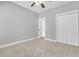 This bedroom features neutral walls, carpeted floors, ceiling fan, and a closet at 1953 Suzanne St, Johns Island, SC 29455