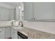 Kitchen with granite countertops, white cabinets and subway tile backsplash, stainless steel dishwasher and sink at 1953 Suzanne St, Johns Island, SC 29455