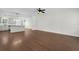Open-concept space with hardwood flooring connecting the living and kitchen areas at 1953 Suzanne St, Johns Island, SC 29455
