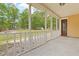 The screened-in porch overlooks the backyard with a concrete-tiled floor at 1953 Suzanne St, Johns Island, SC 29455