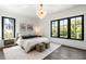 Serene bedroom with large windows offering plenty of natural light and tree views at 20 Old Cedar Ln, Kiawah Island, SC 29455