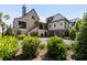 Luxury home featuring manicured landscaping, a private driveway, and an attached two-car garage for upscale living at 20 Old Cedar Ln, Kiawah Island, SC 29455