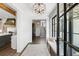 Inviting foyer with hardwood floors, elegant lighting, and modern decor, creating a warm and stylish entry at 20 Old Cedar Ln, Kiawah Island, SC 29455