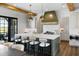Spacious kitchen boasts a large island with seating and stainless steel appliances at 20 Old Cedar Ln, Kiawah Island, SC 29455