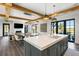 Open kitchen with large island, modern appliances, and seamless flow into the dining and living areas, ideal for entertaining at 20 Old Cedar Ln, Kiawah Island, SC 29455