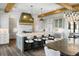 Open-concept kitchen featuring an island with seating, modern appliances, and stylish lighting, perfect for entertaining at 20 Old Cedar Ln, Kiawah Island, SC 29455
