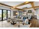 Comfortable living room with a neutral color palette and an open flow to the kitchen at 20 Old Cedar Ln, Kiawah Island, SC 29455