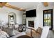 Living room features a fireplace, large-screen TV, and access to the outdoor space at 20 Old Cedar Ln, Kiawah Island, SC 29455