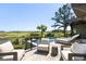Outdoor pool and patio area with lounge chairs, overlooking lush green landscape and golf course at 20 Old Cedar Ln, Kiawah Island, SC 29455