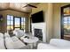 Inviting porch with fireplace and comfortable seating, perfect for relaxing and entertaining at 20 Old Cedar Ln, Kiawah Island, SC 29455