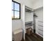 Well-organized walk-in closet with custom shelving, drawers, and natural light from a window at 20 Old Cedar Ln, Kiawah Island, SC 29455