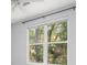 Bedroom showcasing a window with a view and a ceiling fan at 200 Bucksley Ln # 302, Charleston, SC 29492