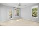 Spacious bedroom with ceiling fan and windows at 200 Bucksley Ln # 302, Charleston, SC 29492
