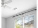 Bright bedroom showcasing a modern ceiling fan and double hung windows with a peaceful outside view at 200 Bucksley Ln # 302, Charleston, SC 29492
