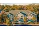 Multi-story building with balconies surrounded by mature trees and landscaping at 200 Bucksley Ln # 302, Charleston, SC 29492