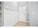 A clean, light gray entryway with white trim and a white door, creating a bright and inviting space at 200 Bucksley Ln # 302, Charleston, SC 29492