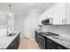 Modern kitchen featuring stainless steel appliances, granite countertops, and white subway tile backsplash at 200 Bucksley Ln # 302, Charleston, SC 29492