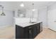 Kitchen island with black cabinets, granite countertop and stainless steel dishwasher at 200 Bucksley Ln # 302, Charleston, SC 29492