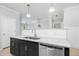 Modern kitchen with stainless appliances, a granite countertop, and ample space, providing a clean and efficient layout at 200 Bucksley Ln # 302, Charleston, SC 29492