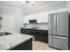 Stylish kitchen features stainless appliances, modern cabinets, and beautiful gray countertops for a sleek look at 200 Bucksley Ln # 302, Charleston, SC 29492