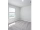Bright bedroom with soft gray carpet and natural light from the window at 205 W Bradford Pointe Dr, Summerville, SC 29483