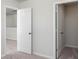 Hallway displaying doors, neutral walls, carpet and access to a room at 205 W Bradford Pointe Dr, Summerville, SC 29483