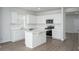 Bright kitchen featuring white cabinetry, quartz countertops, and stainless steel appliances at 205 W Bradford Pointe Dr, Summerville, SC 29483