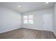 Bright living room featuring wood-look flooring, neutral paint, and ample natural light at 205 W Bradford Pointe Dr, Summerville, SC 29483