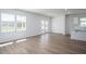 Bright living room with wood floors, white walls and lots of light from windows and doors at 205 W Bradford Pointe Dr, Summerville, SC 29483