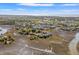 Aerial shot of a charming coastal community, featuring lovely homes and scenic marsh views under a clear sky at 2105 Landfall Way, Seabrook Island, SC 29455