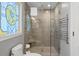 The bathroom features a glass enclosed shower, decorative accent window, and a heated towel rack at 2105 Landfall Way, Seabrook Island, SC 29455