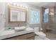 This luxurious bathroom boasts a marble countertop, vessel sink, and glass shower at 2105 Landfall Way, Seabrook Island, SC 29455