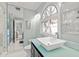 Stylish bathroom with a glass shower, an arched window, and a modern vanity with a vessel sink at 2105 Landfall Way, Seabrook Island, SC 29455