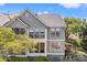 Beautiful two-story home featuring large windows offering ample natural light and views of the surrounding landscape at 2105 Landfall Way, Seabrook Island, SC 29455