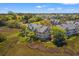 Aerial view showcases the back of the condo building with screened porches, surrounded by lush marshland and trees at 2105 Landfall Way, Seabrook Island, SC 29455