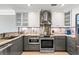 Stylish kitchen featuring custom cabinets, granite countertops, and stainless steel appliances at 2105 Landfall Way, Seabrook Island, SC 29455