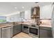 Modern kitchen with granite countertops, stainless steel appliances and gray cabinets at 2105 Landfall Way, Seabrook Island, SC 29455