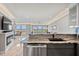Well-lit kitchenette with views into the living and dining area at 2105 Landfall Way, Seabrook Island, SC 29455
