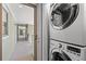 Stacked washer and dryer beside a hallway at 2105 Landfall Way, Seabrook Island, SC 29455