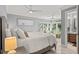 This primary bedroom features ample natural light and serene decor at 2105 Landfall Way, Seabrook Island, SC 29455