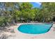 Outdoor community pool surrounded by lounge chairs and lush landscaping for relaxing and recreation at 2105 Landfall Way, Seabrook Island, SC 29455
