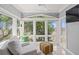 This inviting sitting area features abundant natural light and picturesque nature views at 2105 Landfall Way, Seabrook Island, SC 29455
