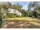 Expansive backyard with mature trees and abundant greenery at 2137 Wappoo Dr, Charleston, SC 29412